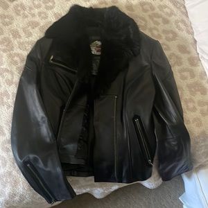 Black with faux fur liner on the collar.